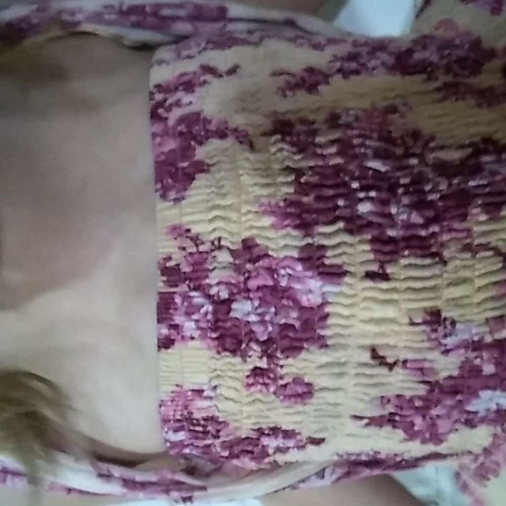 A pink dress with purple flowers